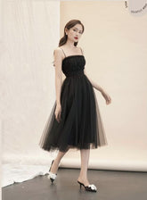 Sleeveless organza midi dress with ruched bodice and full A-line silhouette